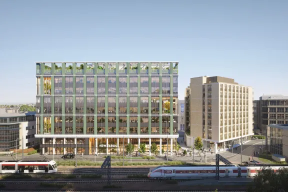Rendering of the New Yards Haymarket building in Edinburgh, with a train and tram passing by.