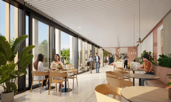 Interior rendering of the cafe area at New Yards Haymarket, showcasing modern design and inviting seating arrangements.