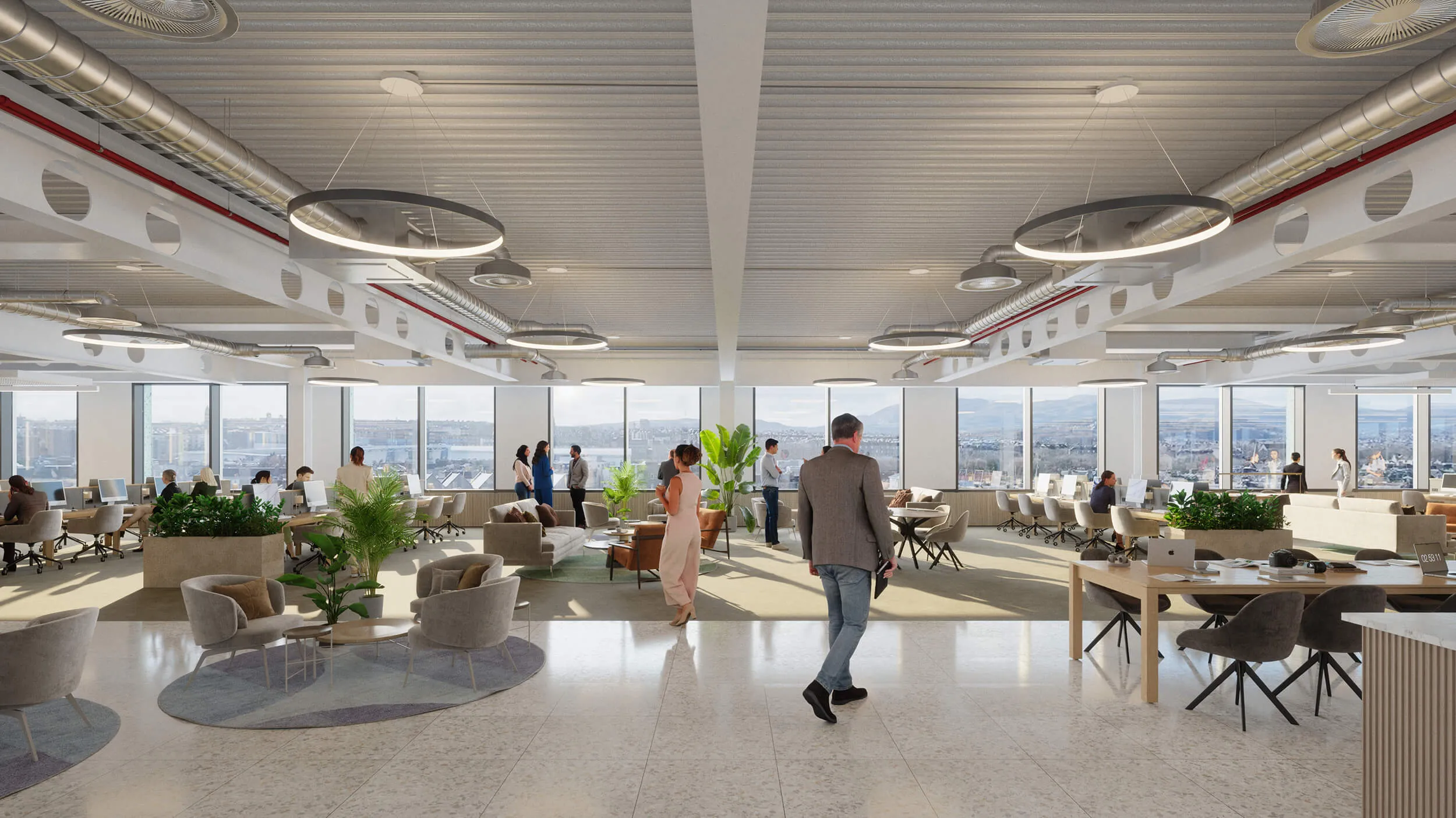 Spacious open-plan office at New Yards Haymarket with panoramic city views, collaborative seating areas, large windows, and modern industrial-style ceiling design.