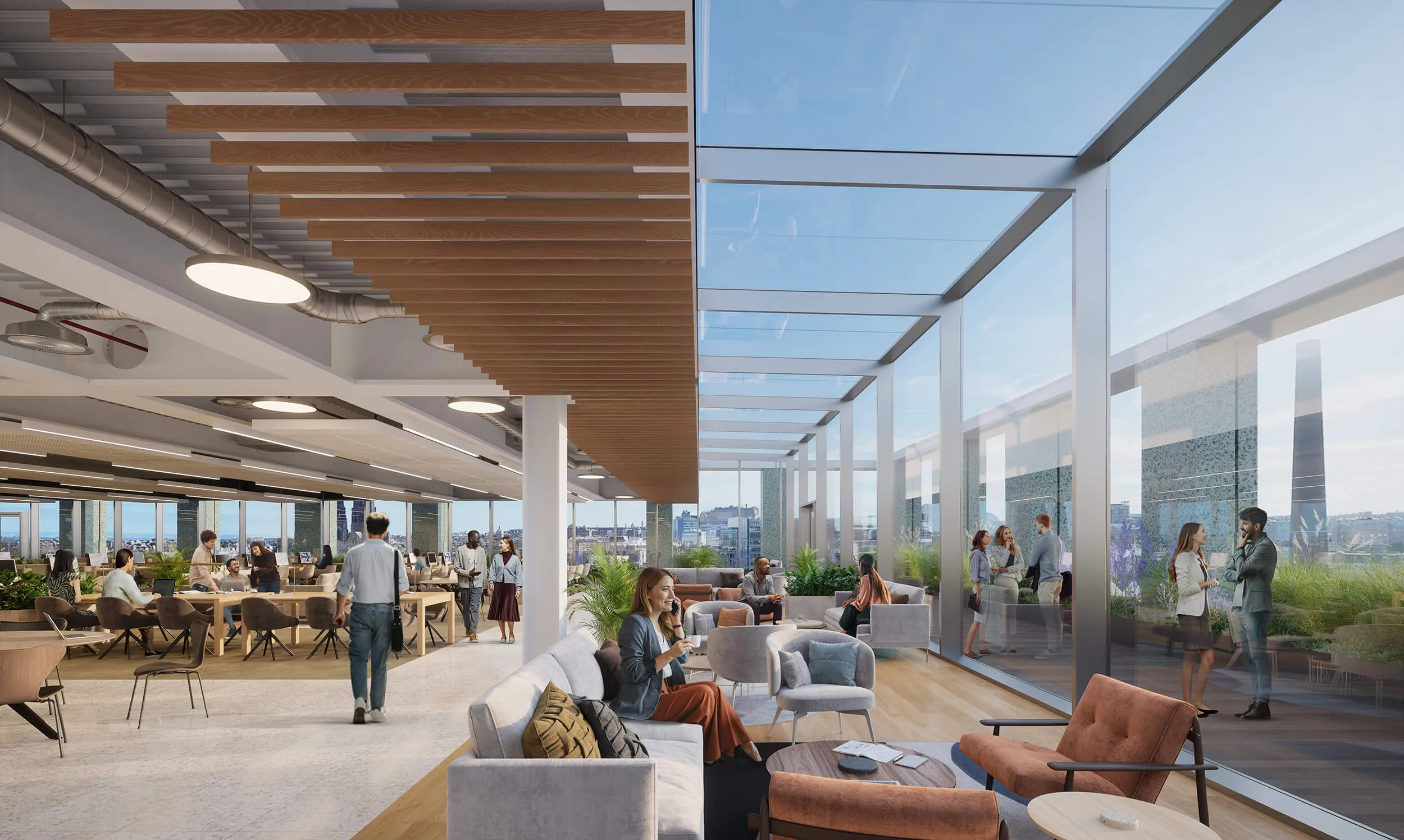 Lounge area in open plan office space featuring floor to ceiling windows with views of Edinburgh