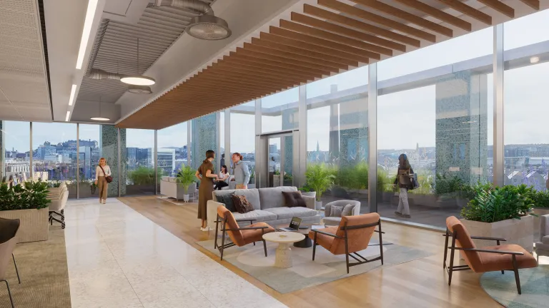 Collaborative lounge area in open office space in New Yards Haymarket featuring large windows 