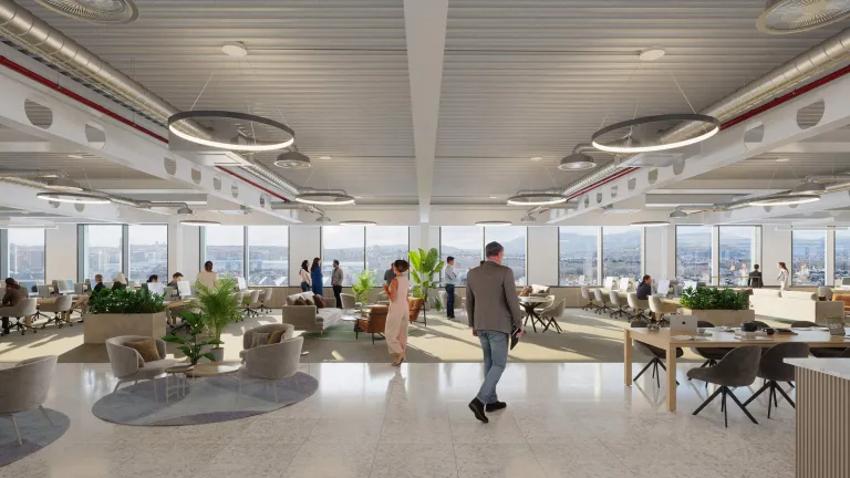 Spacious open-plan office at New Yards Haymarket with panoramic city views, collaborative seating areas, large windows, and modern industrial-style ceiling design.